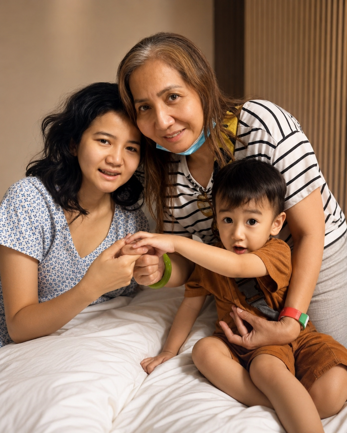 Joan Marie Gonzales with her mother and her son Hero