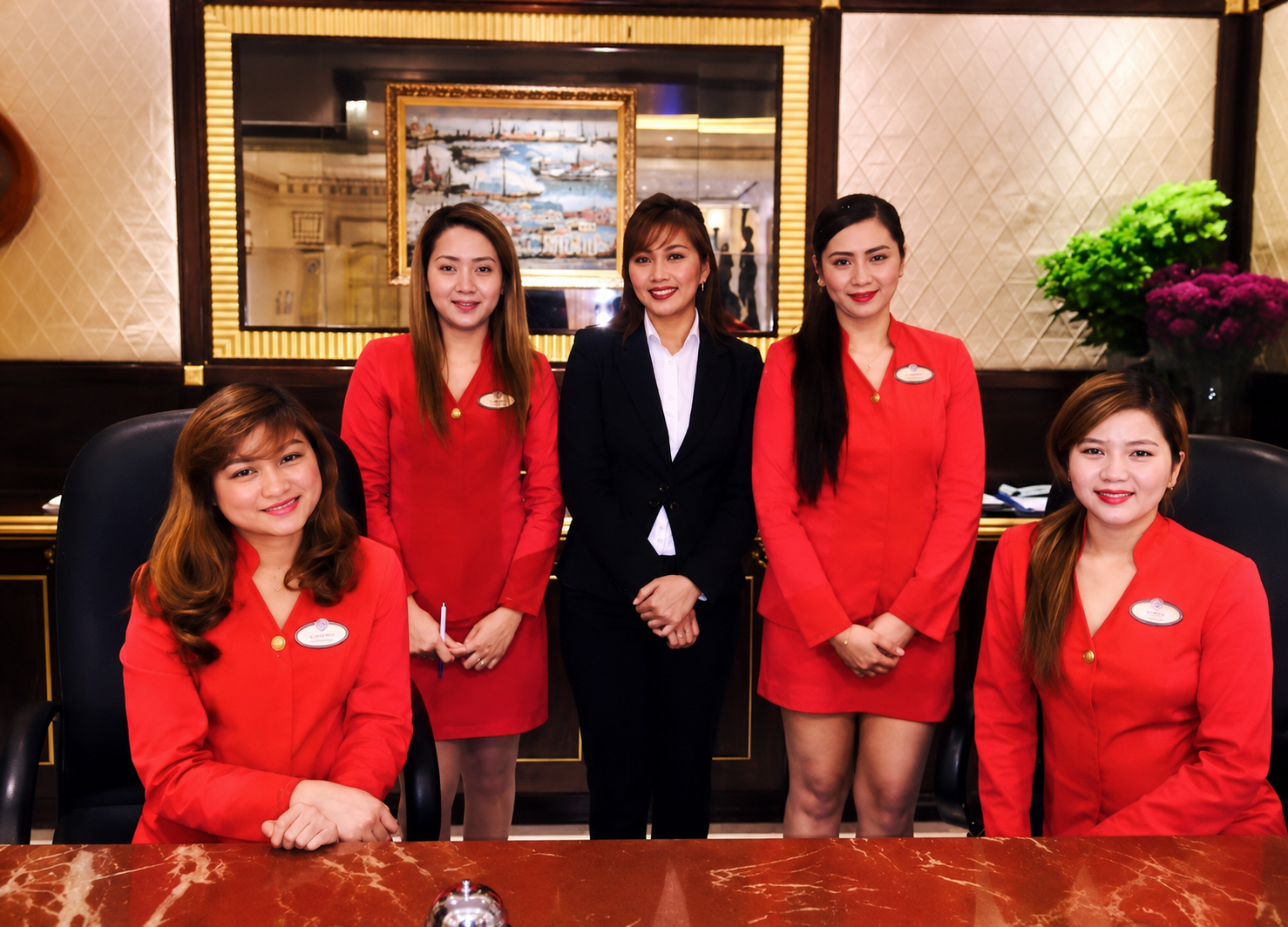 Joan Marie Gonzales working as a hotel receptionist in Dubai